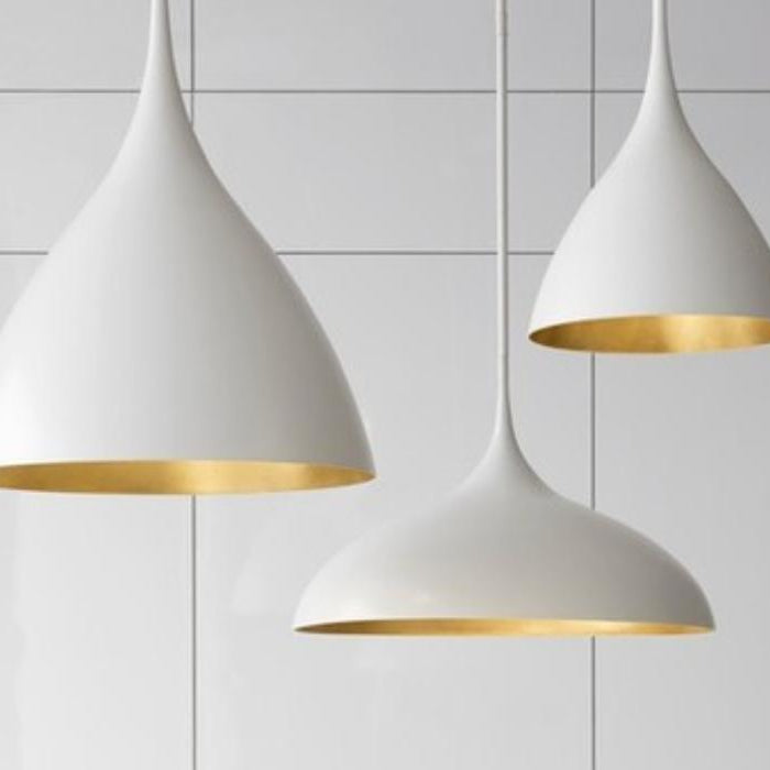 White dome pendant lights with gold interior